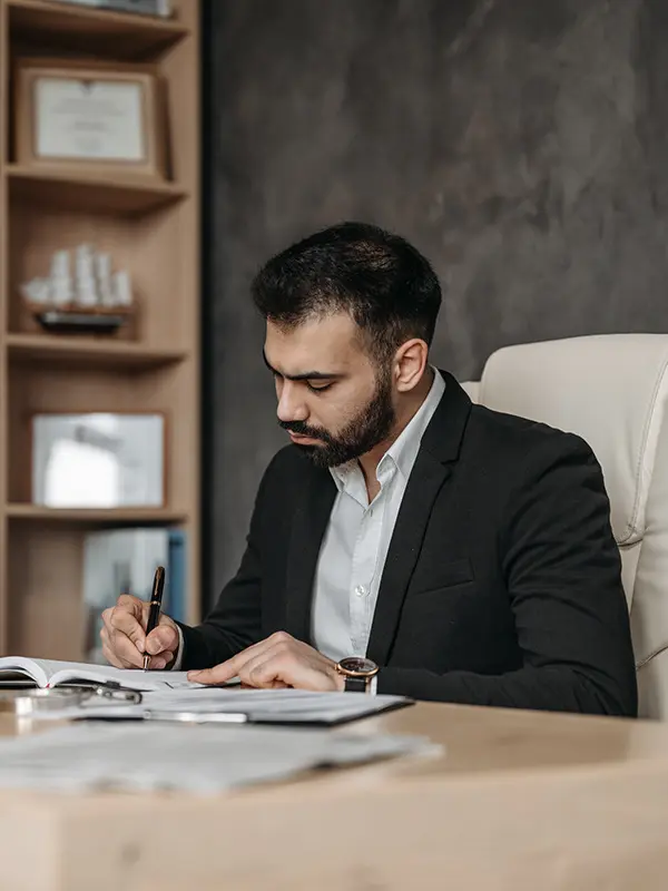 Image of a lawyer signing a document